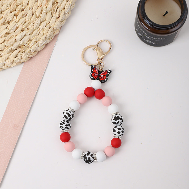 Wholesale Rubber Tassel Silicone Wood Water Keychain